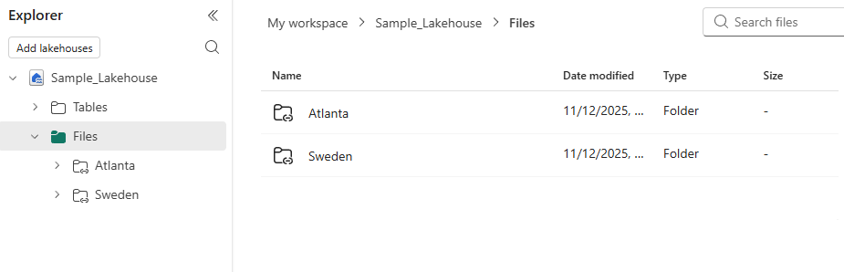 Screenshot showing the lakehouse explorer view with a list of folders that display the shortcut symbol.