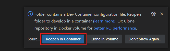 Recorte de pantalla de una notificación del sistema para volver a abrir la carpeta actual en el contexto de un contenedor de desarrollo.