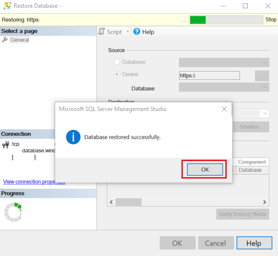 Captura de tela de uma caixa de diálogo em uma página no assistente **Restaurar**. Uma mensagem na caixa de diálogo indica que o banco de dados foi restaurado com êxito.